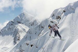 Fototapetă vlies snowboarder pe munți 375 x 250 cm