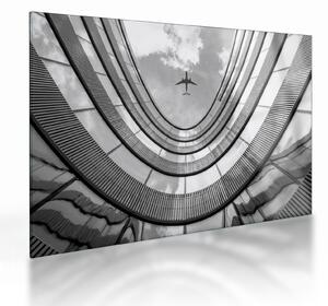 Tablou pe sticlă - Avionul deasupra clădirii (70x50 cm)