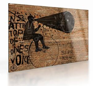 Tablou pe sticlă - Barbat cu biciclete stil Bansky (70x50 cm)