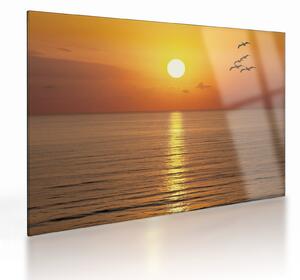 Tablou pe sticlă - Apus de soare peste ocean (70x50 cm)