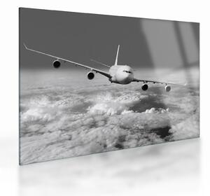 Tablou pe sticlă - Avion în nori, alb și negru (70x50 cm)