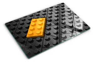 Tocător din sticlă Cărămizi LEGO pe fundal negru