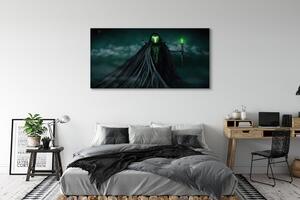 Tablouri canvas Figura întunecată de foc verde