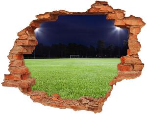 Autocolant un zid spart cu priveliște teren de fotbal