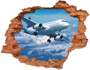 Autocolant un zid spart cu priveliște Avionul în nori