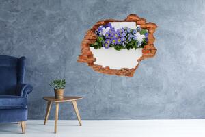 Fototapet un zid spart cu priveliște flori albastre