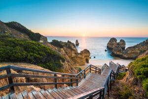 Fotografie Walkway to idyllic beach, Algarve, Portugal, © Marco Bottigelli