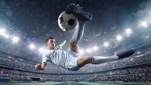 Fotografie de artă Soccer player kicking ball in stadium, Dmytro Aksonov, (40 x 22.5 cm)
