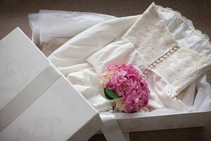 Fotografie de artă Pink hydrangea on wedding dress in box, Tom Merton, (40 x 26.7 cm)