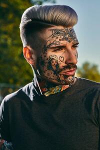 Fotografie de artă Portrait of tattooed young man outdoors, Westend61, (26.7 x 40 cm)
