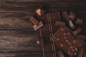 Fotografie de artă Chocolate bars with nuts and candies close-up., Olena Ruban, (40 x 26.7 cm)