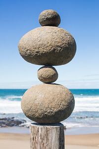 Fotografie de artă Tower of rocks balancing on a wooden pole, Dimitri Otis, (26.7 x 40 cm)