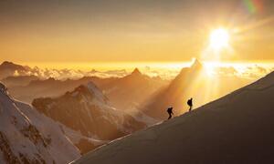 Fotografie de artă Climbers on a snowy ridge at sunrise, Buena Vista Images, (40 x 24.6 cm)