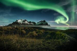 Fotografie northern lights over Vestrahorn moutain , Iceland, Peerasit Chockmaneenuch