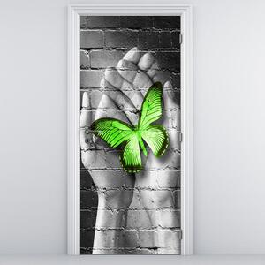 Fototapeta pentru ușă - Fluture verde în palmă (95x205cm)