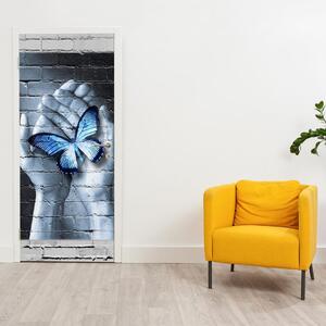 Fototapeta pentru ușă - fluture albastru în palmă (95x205cm)