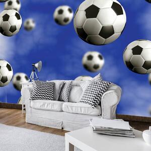 Fototapet - Mingi de fodbal pe fundal albastru (152,5x104 cm)