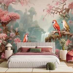 Tapet O pădure tropicală de basm, cu papagali, copaci înfloriți cu flori roz și o cascadă., Fototapet Animale, Fototapet papagali, w09580 : Uwalls.ro