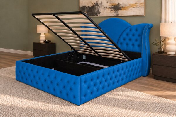 Pat tapițat Chesterfield din catifea Velora Deluxe Classic 140×200 cm, albastru, cu ladă de depozitare