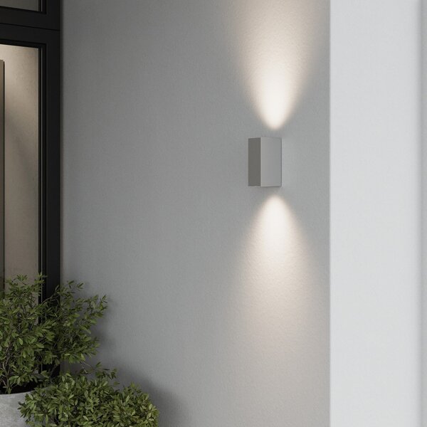 Lucande Aplică de perete exterior Tavi, 15 cm, argintiu, IP54, Gri, Hol, Metal, Modern, Priză de perete sus / jos