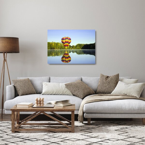 Tablou pe sticlă cu balon cu aer cald pe un lac (70x50 cm)