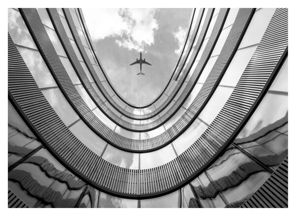 Tablou pe sticlă - Avionul deasupra clădirii (70x50 cm)
