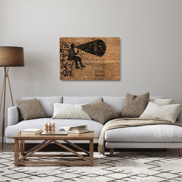 Tablou pe sticlă - Barbat cu biciclete stil Bansky (70x50 cm)
