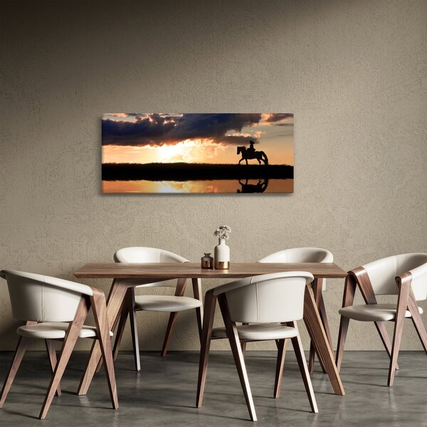 Tablou - Rider pe un cal la apus de soare (120x50 cm)