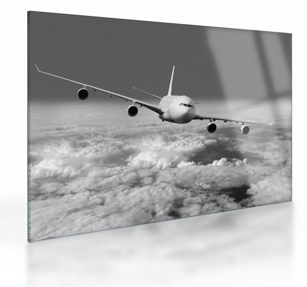 Tablou pe sticlă - Avion în nori, alb și negru (70x50 cm)