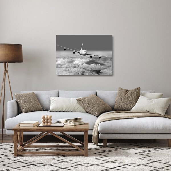 Tablou pe sticlă - Avion în nori, alb și negru (70x50 cm)