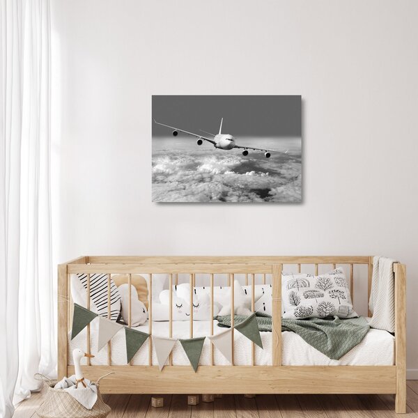 Tablou pe sticlă - Avion în nori, alb și negru (70x50 cm)