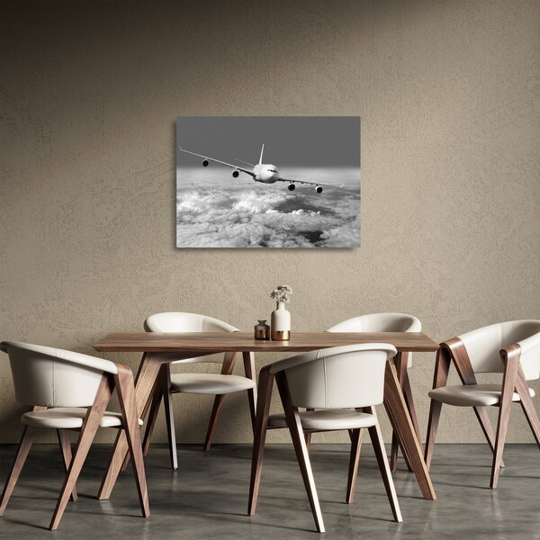 Tablou pe sticlă - Avion în nori, alb și negru (70x50 cm)