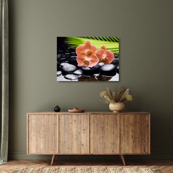 Tablou pe sticlă - Orhidee portocalie cu frunze de palmier (70x50 cm)