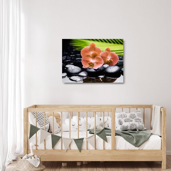 Tablou pe sticlă - Orhidee portocalie cu frunze de palmier (70x50 cm)