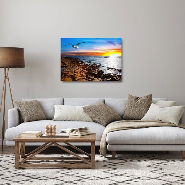 Tablou pe sticlă - Pescărușul zboară deasupra coastei (70x50 cm)