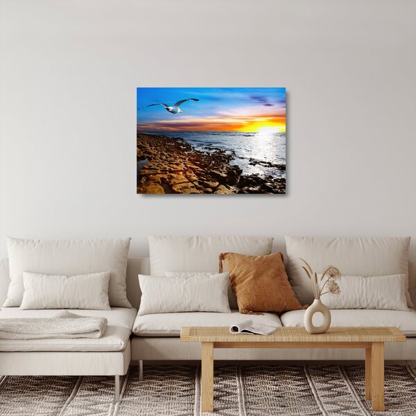 Tablou pe sticlă - Pescărușul zboară deasupra coastei (70x50 cm)
