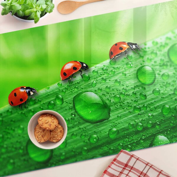 Tocător sticlă Buburuze pe un fundal verde