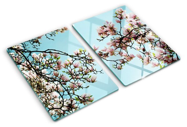 Tocător din sticlă Flori de magnolie pe fundal albastru