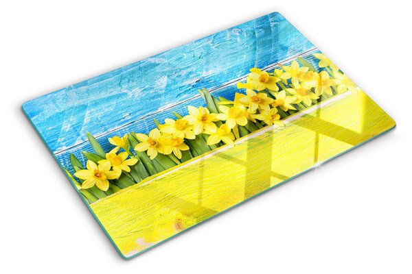 Tocător sticlă Flori de narcisă pe fundalul cerului