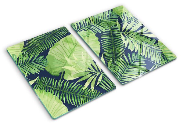 Tocător din sticlă Frunze tropicale pe un fundal întunecat