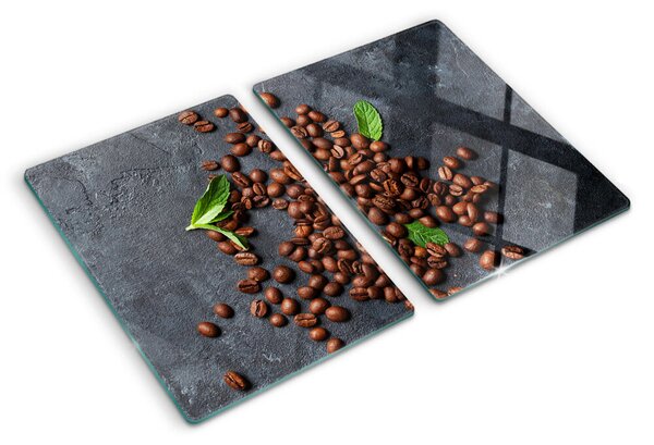 Tocător din sticlă Boabe de cafea pe un fundal de piatră