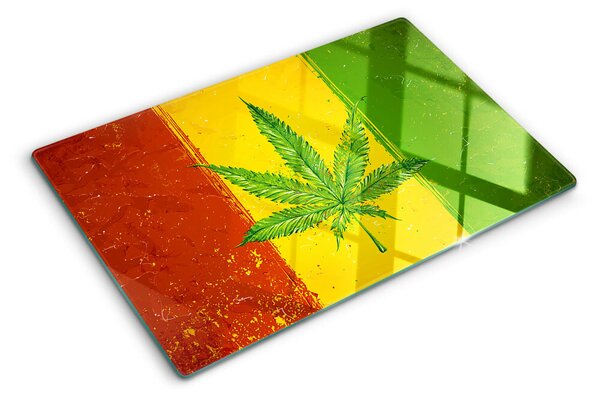 Tocător din sticlă Frunză de canabis pe un fundal colorat