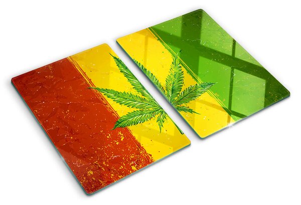 Tocător din sticlă Frunză de canabis pe un fundal colorat