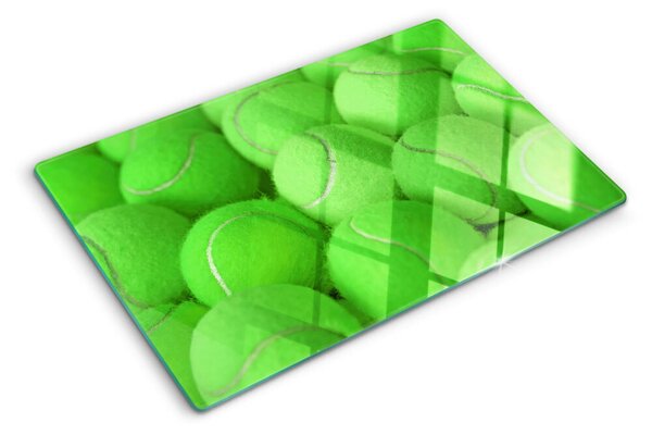 Tocător sticlă Mingi de tenis pe un fundal verde