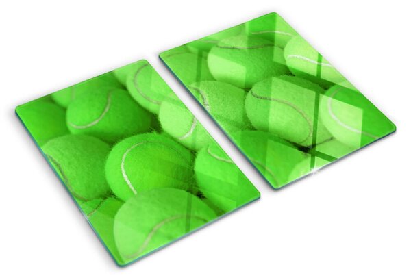 Tocător sticlă Mingi de tenis pe un fundal verde