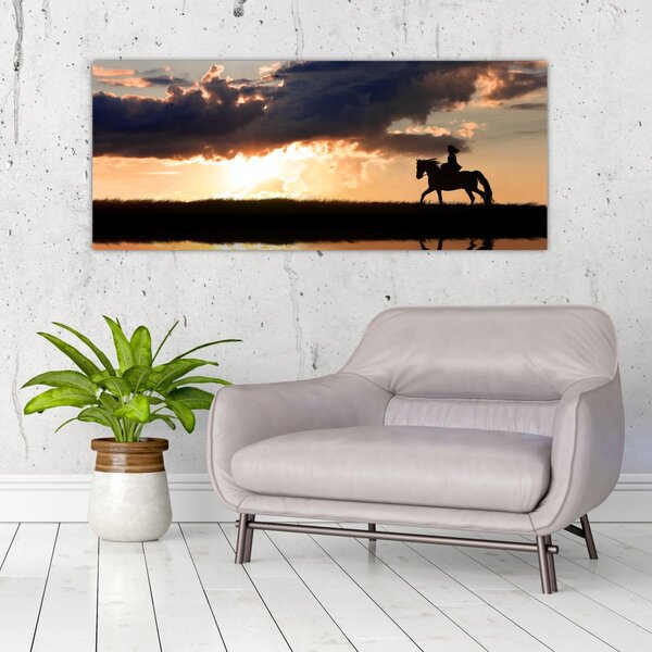 Tablou - Rider pe un cal la apus de soare (120x50 cm)