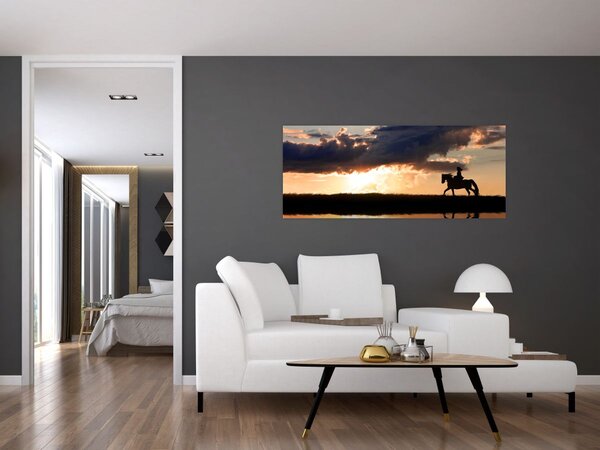 Tablou - Rider pe un cal la apus de soare (120x50 cm)
