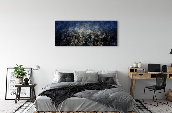 Tablouri canvas Mâinile de lumină albastră