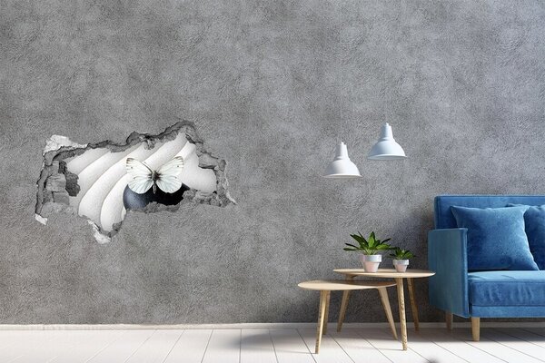 Autocolant gaură 3D Un fluture pe o piatră într-un decor Zen