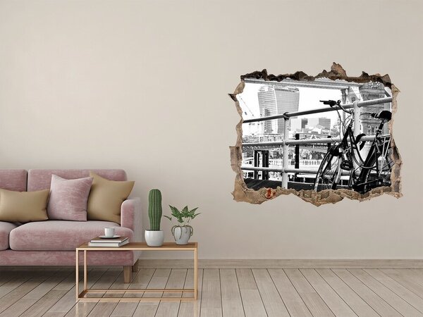 Fototapet 3D gaură în perete O bicicletă pe cheiul orașului